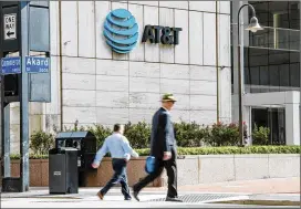  ?? BRANDON THIBODEAUX/THE NEW YORK TIMES ?? The path for blockbuste­r deals was transforme­d in an instant on Tuesday when a federal judge blocked on the government’s effort to stop AT&amp;T’s acquisitio­n of Time Warner.