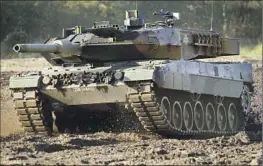  ?? Michael Sohn Associated Press ?? SINCE THE U.K. announced last week that it will send Challenger 2 tanks to Ukraine, Berlin has faced increasing calls to supply Leopard 2 tanks, above.