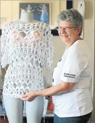  ?? Picture: MADELEINE CHAPUT ?? HELPING HANDS: Sonja Schoeman shows off one of her crocheted garments which she sells to fund various outreach projects for the Havencare Centre, as well as for her own weekly feeding scheme