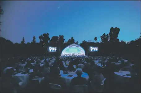  ?? Photograph­s by Melissa Kobe ?? LOVE IS BLUE as the Pasadena Symphony celebrates Leonard Bernstein’s birthday Saturday night at the Arboretum in Arcadia.