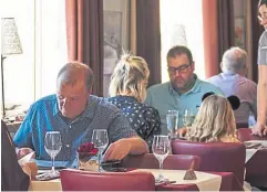  ?? ?? Guests peruse The Galley’s varied menu