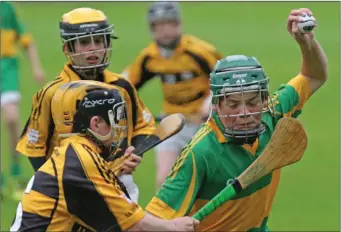  ??  ?? Joseph Rossiter of Blackwater under pressure from Rathnure’s Charlie Mooney.