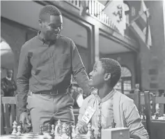  ?? EDWARD ECHWALU ?? Robert ( David Oyelowo) has wise words about chess, and life, for young Phiona ( Madina Nalwanga) in Queen of Katwe.