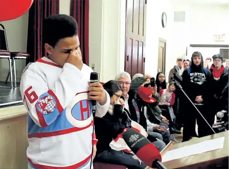  ?? LAURA BARTON/POSTMEDIA NEWORK ?? Port Colborne teen Jayden Hannigan holds back tears, overwhelme­d by the number of people who came out to support him and his girlfriend Ruby Benner. They were recently the target of racism.