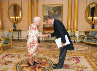  ?? (Dominic Lipinski/Pool/Reuters) ?? AMBASSADOR MARK REGEV meets Queen Elizabeth during a private audience at Buckingham Palace in 2016.