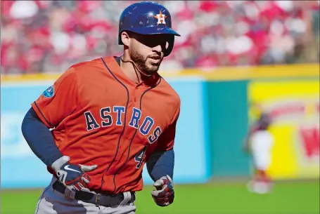  ?? PHIL LONG/AP PHOTO ?? A year after winning MVP honors and leading the Houston Astros to their first World Series title, former UConn great George Springer is off to another hot start in the postseason. He hit three home runs during a three-game sweep of Cleveland in the American League Division Series and now returns to New England on Saturday for Game 1 of the ALCS against the Red Sox at Fenway Park.