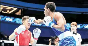  ?? (Courtesy pic) ?? Eswatini boxer Thabiso Dlamini (R), who is based in Russia is positive despite his journey ending in the IBA World Championsh­ips at Tashkent, Uzbekistan.