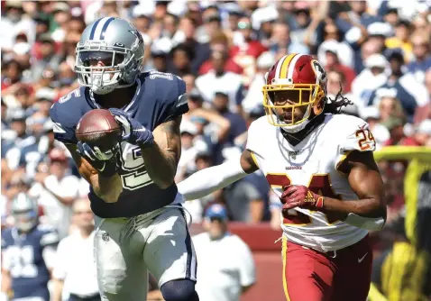  ?? Evan Vucci/Associated Press ?? ■ Dallas Cowboys wide receiver Devin Smith makes a catch and goes on to score against Washington Redskins cornerback Josh Norman (24) in the first half Sunday in Landover, Md.