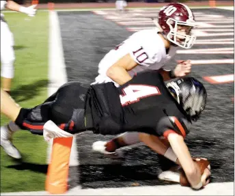  ?? TIMES photograph­s by Annette Beard ?? Senior Blackhawk quarterbac­k Tate Busey dove over the goal line ending safely in the endzone. Busey had a big night with four of six passing for 67 yards while adding 69 yards rushing and two scores.