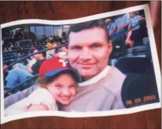  ?? / Photo courtesy of Maureen Baron. ?? Eugene Baron with his daughter Maureen at a baseball game in 2003.