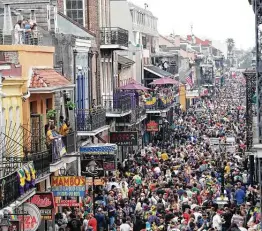  ?? Rusty Costanza / Associated Press file photo ?? Pre-pandemic Bourbon Street is a sea of humanity on Mardi Gras day, Feb. 25, 2020, in New Orleans. A subdued 2021 Carnival season began Wednesday.