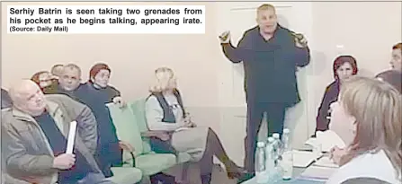  ?? (Source: Daily Mail) ?? Serhiy Batrin is seen taking two grenades from his pocket as he begins talking, appearing irate.