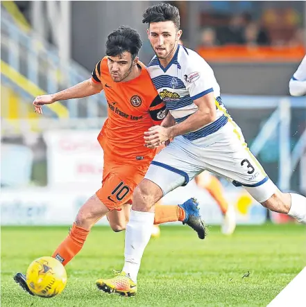  ??  ?? Morton’s Ricki Lamie gets in tight to tackle United’s Scott Fraser.