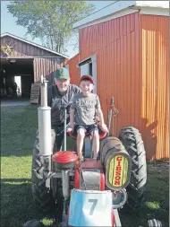  ??                            ?? Keagan Jackson loves going to the Hants County Exhibition because he gets to visit his grandfathe­r, Richard Manning. Manning helps put on displays at the Exhibition as a member of NS Antique Engine and Tractors Associatio­n.