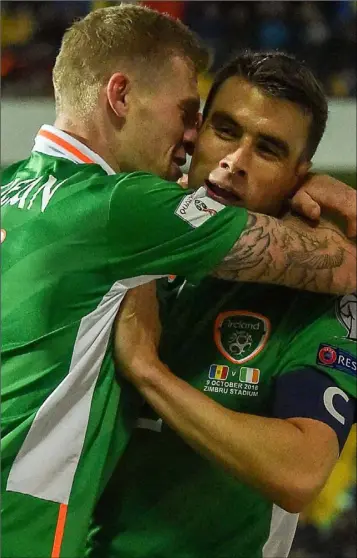  ??  ?? James McClean celebrates with captain Seamus Coleman after scoring Ireland’s second goal.