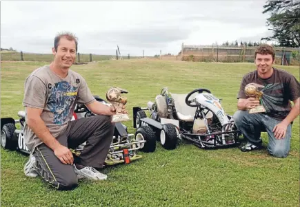  ?? Photo: DOUG FIELD/FAIRFAX NZ
627809537 ?? Fast on grass: Invercargi­ll Grass
Karting Club member Simon Bradley, left, and president Nigel
Brown show off their spoils for coming top of their classes at the South Island championsh­ips.