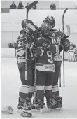  ??  ?? The Kings celebrate Jeremey Goodwin’s goal Sunday afternoon that signalled the tossing of hats and mitts onto the ice.