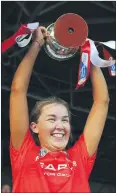  ?? (Pic: INPHO/ Tommy Grealy) ?? Cork and Sarsfields’ Orlaith Mullins lifts the cup following the 2-11 to 2-7 victory over Galway.