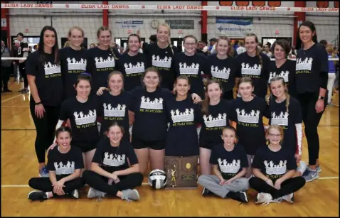  ?? Staff photo/Mike Frank ?? Members of the New Knoxville volleyball team pose with the Region 14 trophy after defeating Calvert in four sets on Saturday afternoon at Elida. The Rangers play in the state semifinals on Thursday.