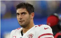  ?? ?? Jimmy Garoppolo sits on the bench as the San Francisco 49ers lose to the Los Angeles Rams, 20-17 in the NFC championsh­ip game.
