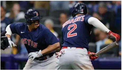  ?? getty imageS ?? BLAST OFF: Rafael Devers celebrates his two-run home run with Xander Bogaerts during the eighth inning of Game 2 of the American League Division Series against the Tampa Bay Rays at Tropicana Field on Friday night in St Petersburg, Fla.