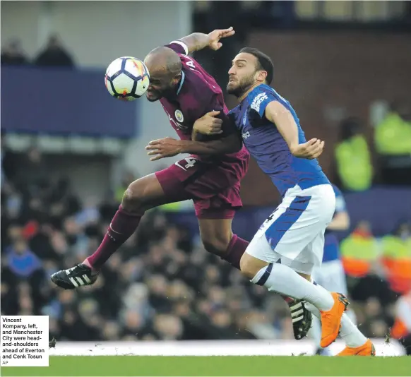  ??  ?? Vincent Kompany, left, and Manchester City were headand-shoulders ahead of Everton and Cenk Tosun