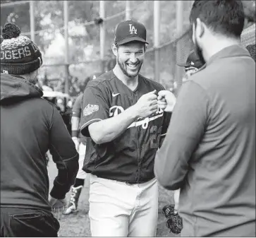  ?? Kent Nishimura Los Angeles Times ?? CLAYTON KERSHAW, who is set to be on the mound for the Dodgers against San Francisco on March 26, says that “opening day is a special day in baseball and to get to be a part of it is really cool.”