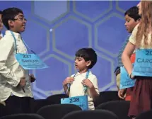  ?? JACK GRUBER, USA TODAY SPORTS ?? Akash Vukoti, 6, talks with other spellers after Round 2 of the 2016 Scripps National Spelling Bee in National Harbor, Md.