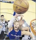  ?? Darren Abate Associated Press ?? BLAKE GRIFFIN, battling Boris Diaw, had 20 points, 19 rebounds, seven assists.