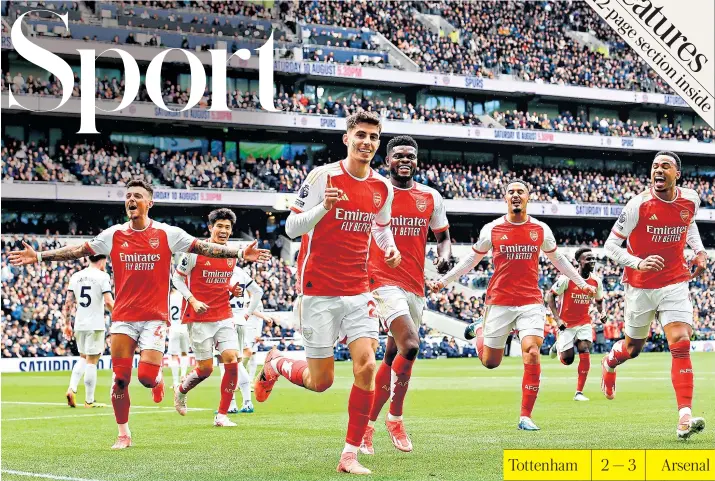  ?? ?? No1 spot: Kai Havertz leads the Arsenal celebratio­ns after putting his side 3-0 ahead in the 38th minute, before Tottenham’s rally left their north London rivals clinging on to their Premier League lead