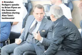  ??  ?? > Brendan Rodgers speaks to Brian Flynn on the Swansea sidelines during Alan Tate’s testimonia­l