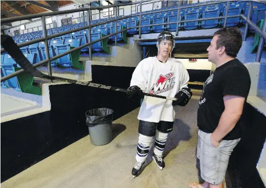  ?? BRYAN SCHLOSSER/LEADER-POST ?? Todd Holt, right, a former Swift Current Broncos player and victim of predator Graham James, has a word with his son Kaelan, who is trying out for the club.