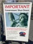  ?? AFP ?? The sign at the Ellis Island ferry cue informs visitors that there was no access to the island or to the Statue of Liberty. —