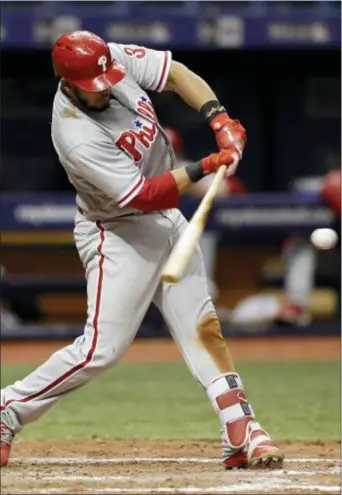  ?? CHRIS O’MEARA — THE ASSOCIATED PRESS ?? The Phillies’ Jorge Alfaro connects for an RBI single off Tampa Bay relief pitcher Alex Colome during the ninth inning Friday in St. Petersburg, Fla. Scott Kingery scored the winning run on the play.