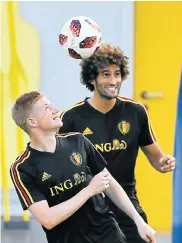  ?? Picture: FRANCK FIFE/AFP ?? SKY-HIGH CONFIDENCE: Belgium’s midfielder Kevin de Bruyne, left, heads the ball next to Marouane Fellaini during a training session ahead of their semifinal against France