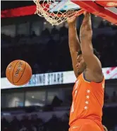  ?? JONATHAN DANIEL/GETTY IMAGES ?? Pelicans star Zion Williamson apparently damaged the rim on a dunk before halftime.