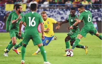  ?? AFP ?? Brazil’s Neymar drives the ball during the friendly match against Saudi Arabia at the King Saud University Stadium in Riyadh on Friday. Brazil won 2-0.