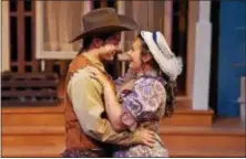  ?? BOB CHRISTY ?? Christophe­r Tuck, as Will Parker, and Samantha Russell, as Ado Annie, perform in the Porthouse Theatre production of “Oklahoma!”