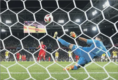  ?? PICTURE: MIKE HEWITT/ FIFA VIA GETTY IMAGES ?? ON THE SPOT: England’s Harry Kane scores the opening goal from a penalty past Colombia goalkeeper David Ospina.