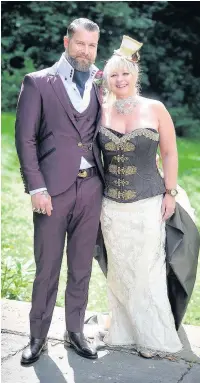  ??  ?? Groom Sebastian Carter and bride Joanna Ricketts at their Alice in Wonderland wedding