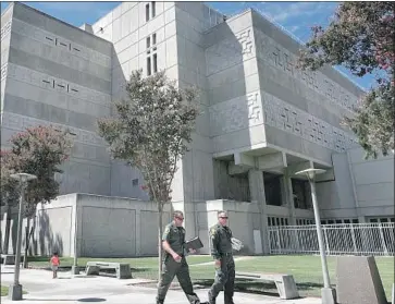  ?? Gary Coronado Los Angeles Times ?? LAWYERS FOR inmates in Orange County jails had argued that crowded conditions and inadequate protection­s against COVID-19 resulted in more than 300 inmates testing positive. Above, the main jail in Santa Ana.