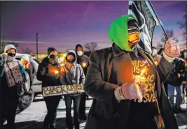  ?? Gaelen Morse The Associated Press ?? A vigil is held for Andre Hill at the Brentnell Community Recreation Center in Columbus, Ohio, on Saturday. The officer who shot and killed Hill was fired Monday.