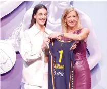  ?? PHOTO BY SARAH STIER/AFP ?? GENERATION­AL PLAYER
Caitlin Clark (left) poses with WNBA Commission­er Cathy Engelbert after being selected first overall pick by the Indiana Fever during the 2024 WNBA Draft at Brooklyn Academy of Music on Monday, April 15, 2024, in New York City. Clark, who smashed records on and off the court in a dazzling US college career, was selected first amid expectatio­ns she will have a transforma­tive effect on women’s profession­al basketball.