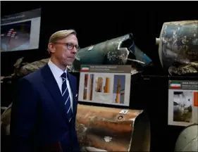  ??  ?? Brian Hook, U.S. special representa­tive for Iran, walks past fragments of Iranian short range ballistic missiles (Qiam) Saturday at the Iranian Materiel Display (IMD) at Joint Base Anacostia-Bolling, in Washington. AP PhoTo/CArolyn KAsTer