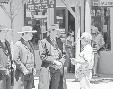  ??  ?? Tombstone merchants and businesses owners aren’t required to dress in period style, but most of them seem to do it anyway.