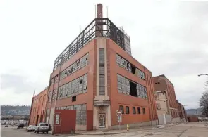  ?? CINCINNATI ENQUIRER FILE ?? The former Hudepohl Brewing Co. building was torn down in 2019, with the U.S. Environmen­tal Protection Agency and the Port of Cincinnati overseeing the removal of debris containing asbestos.