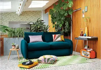  ?? ?? Whimsical: The Small Biggie sofa, in pine green £1,429, from Snugsofa.com