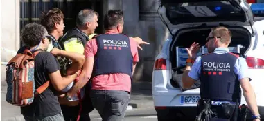  ??  ?? Emergency services respond after the recent attack on Las Ramblas in Barcelona