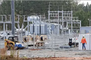  ?? AJC 2023 ?? Interconne­cted transmissi­on stations at the battery energy storage system that Georgia Power is currently constructi­ng and bringing online in Columbus, Ga., is shown in 2023. A Georgia Tech report released Thursday builds on a body of literature documentin­g that the energy burdens of Black households are higher than other races.