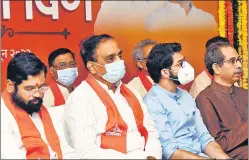  ?? HT FILE ?? Eknath Shinde (left) with Shiv Sena leader Aaditya Thackeray and CM Uddhav Thackeray at an event to mark the party’s Foundation Day in Mumbai on June 19.